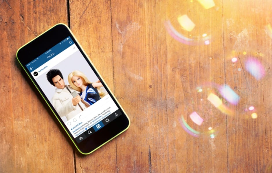 Wooden background with iPhone barbie zoolander Instagram